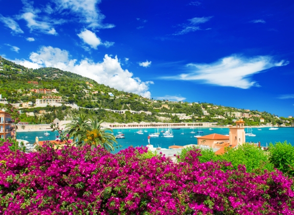 french reviera, view of luxury resort and bay of Villefranche-sur-Mer near Nice and Monaco. seafront landscape with azalea flowers