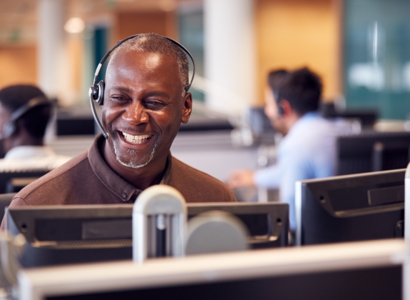Rail expert Wearing Telephone Headset Talking To Caller