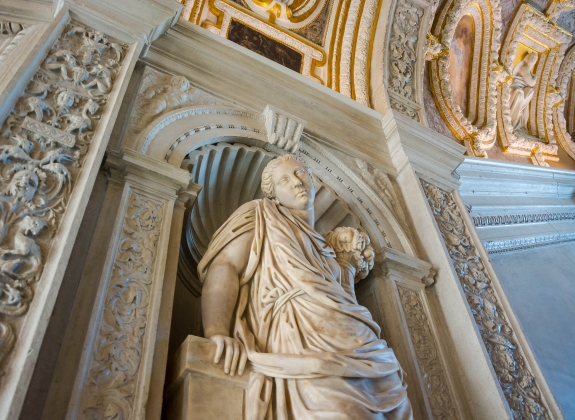 Sculpture in the Doge's Palace, the rich interior decoration of the walls and ceiling. Venice, Italy