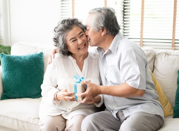 happy couple celebrating a special occasion with presents