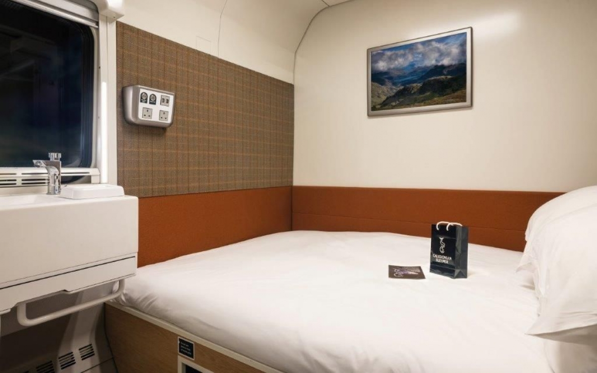 A double bed inside a train cabin