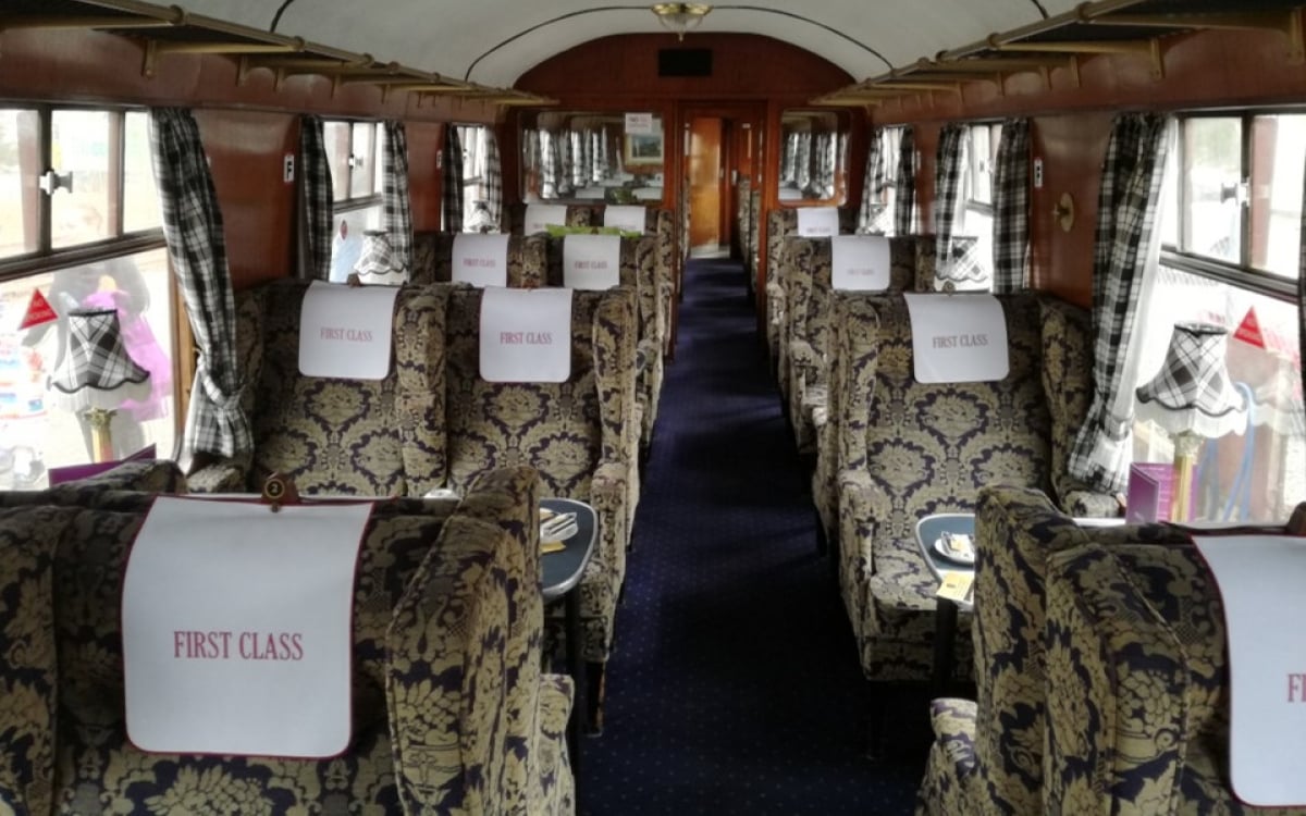 Onboard a traditional steam train with spacious first class seating