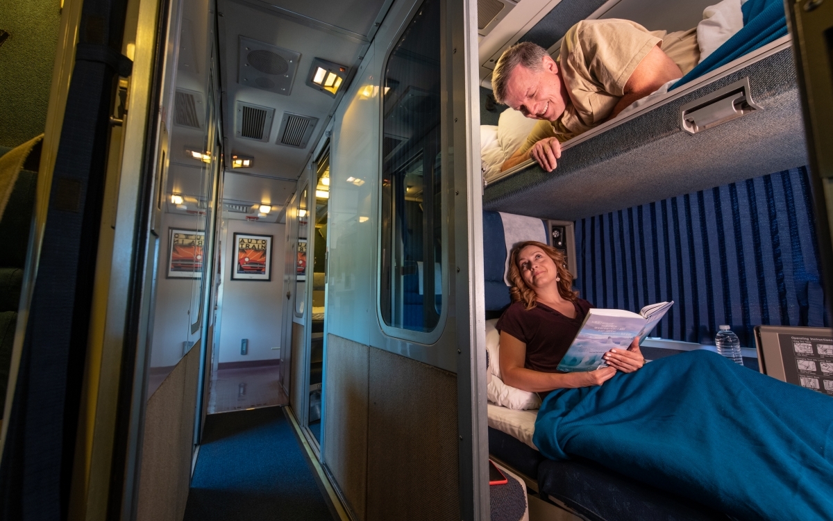 couple relaxing in amtrak roomette