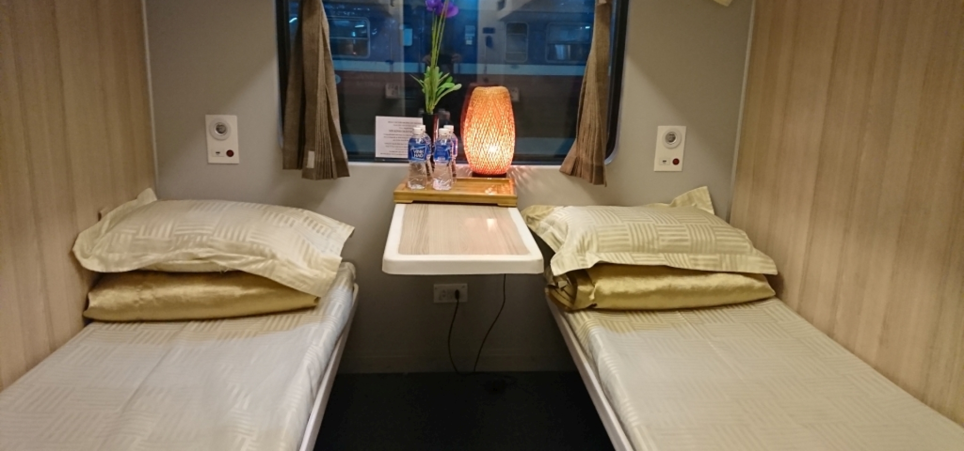 Twin beds in a train cabim