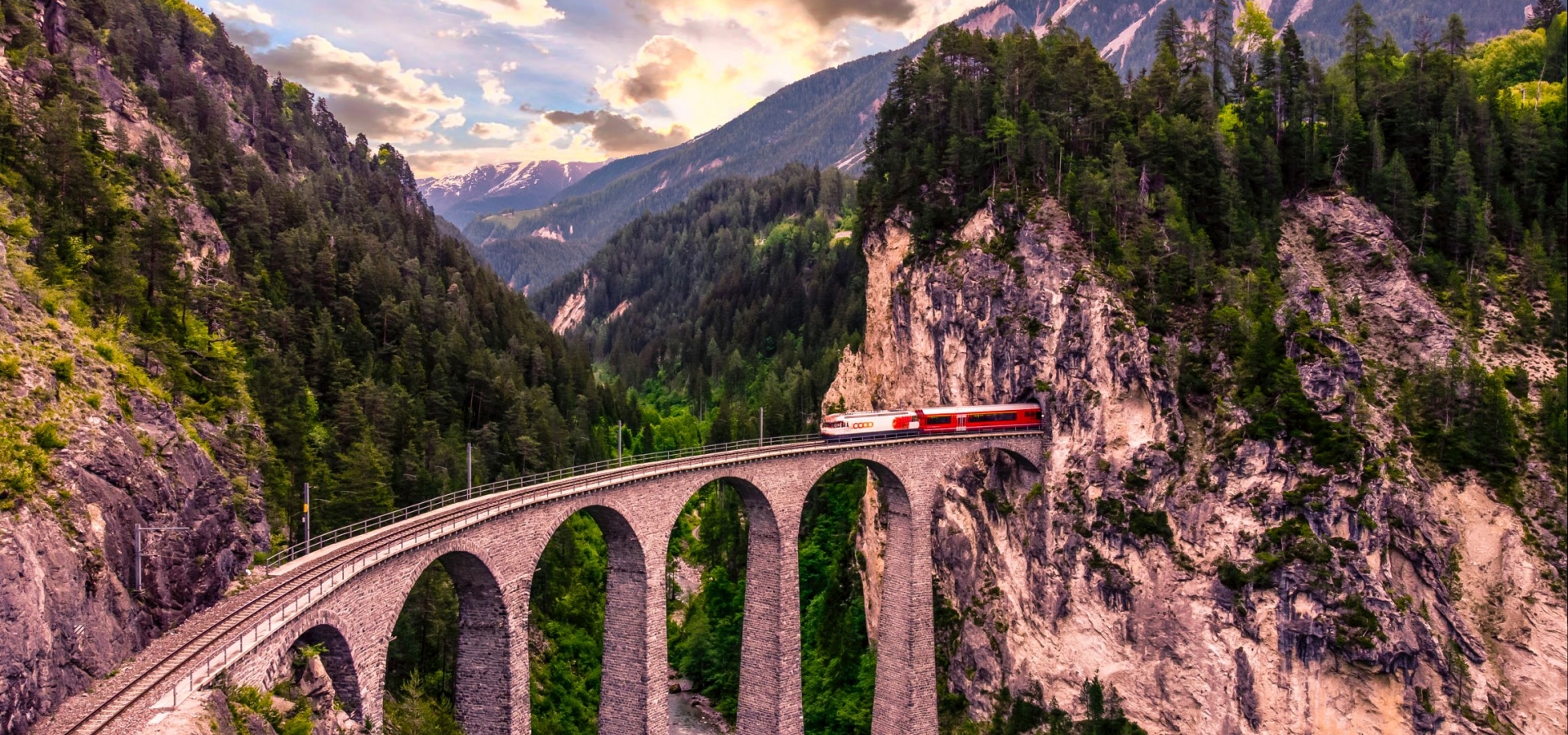 The Landwasser Viadauct - the Bernina Express A train emerges from a tunnel crossing a viaduct