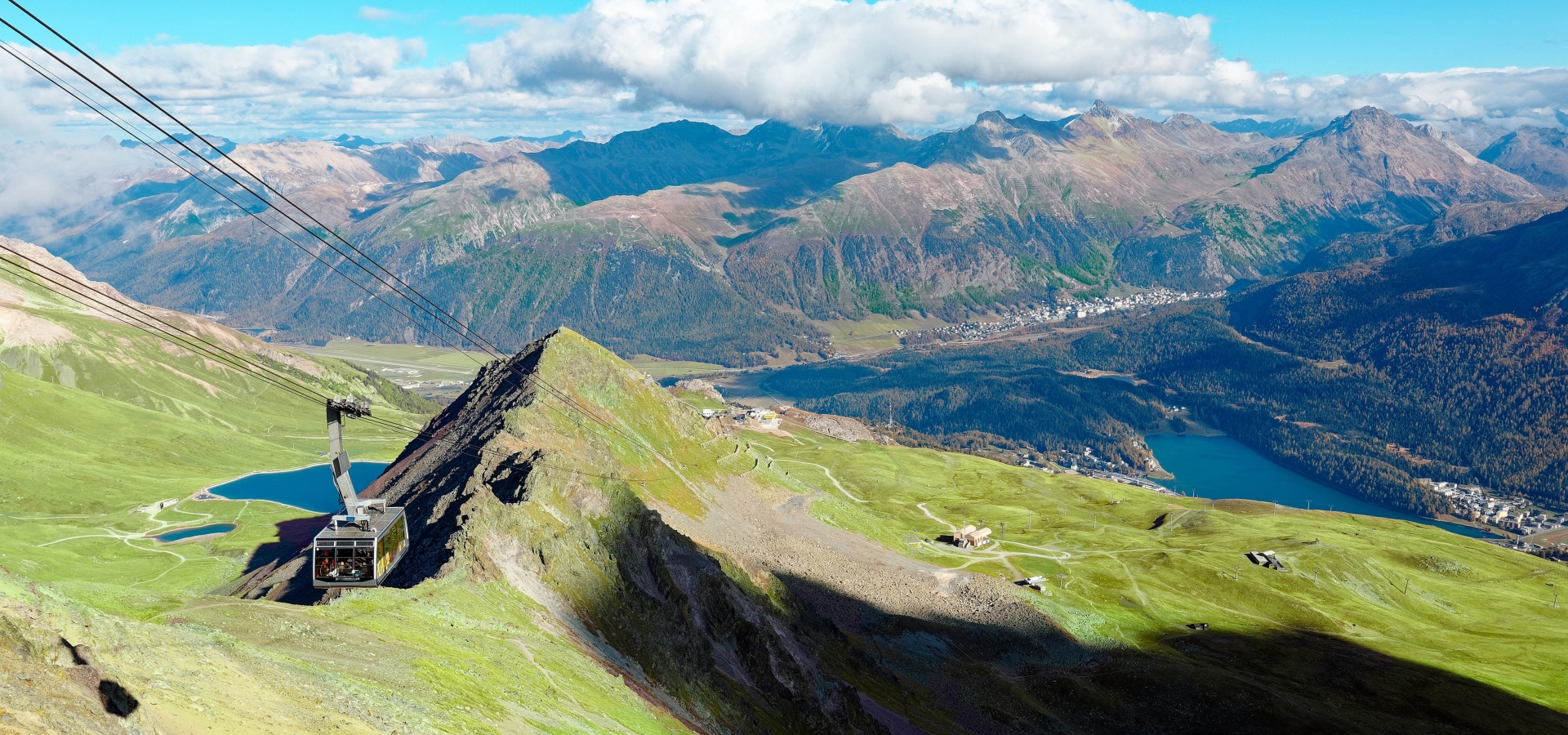 cable-car-flying-over-mountaintop-piz-nair-overlooking-lake-st-moritz_2178162239_web