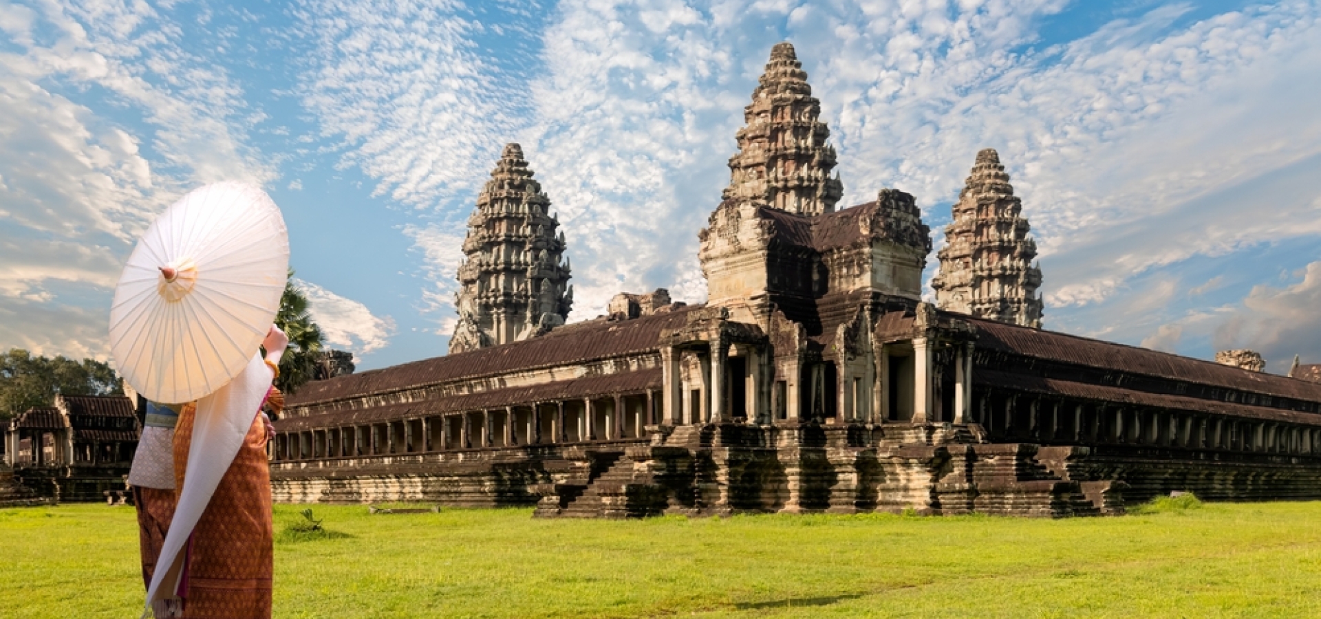 Unidentified young couple green traditional ceremonial wedding Khmer clothing at the ancient Angkor Wat temple - Cambodia