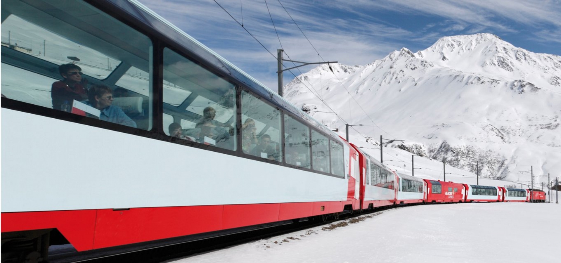 Exterior view of Glacier Express on route in snow