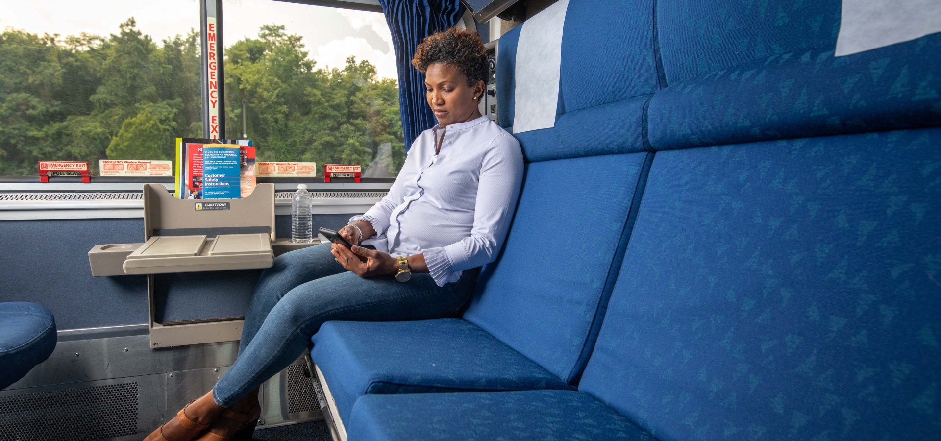Woman relaxing in Amtrak first class private room