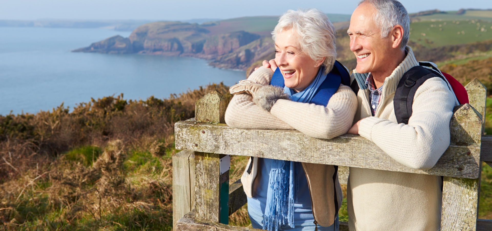 Senior Couple Walking Along Coastal Path