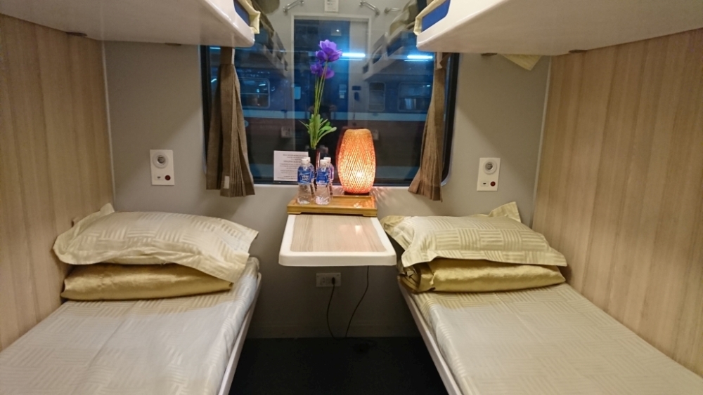 Twin beds in a train cabim