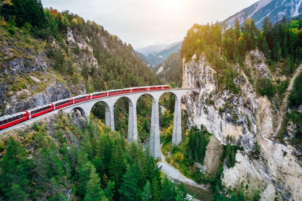 Train crossing Landwasser Viaduct on raethian railway in Filisur