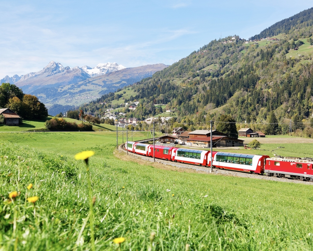 The Glacier Express passing through scenic switzerland landscapes